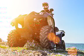 ATV in action equipped with Mitsuboshi belts, delivering high-performance power transmission for rugged, reliable riding in demanding powersports conditions.